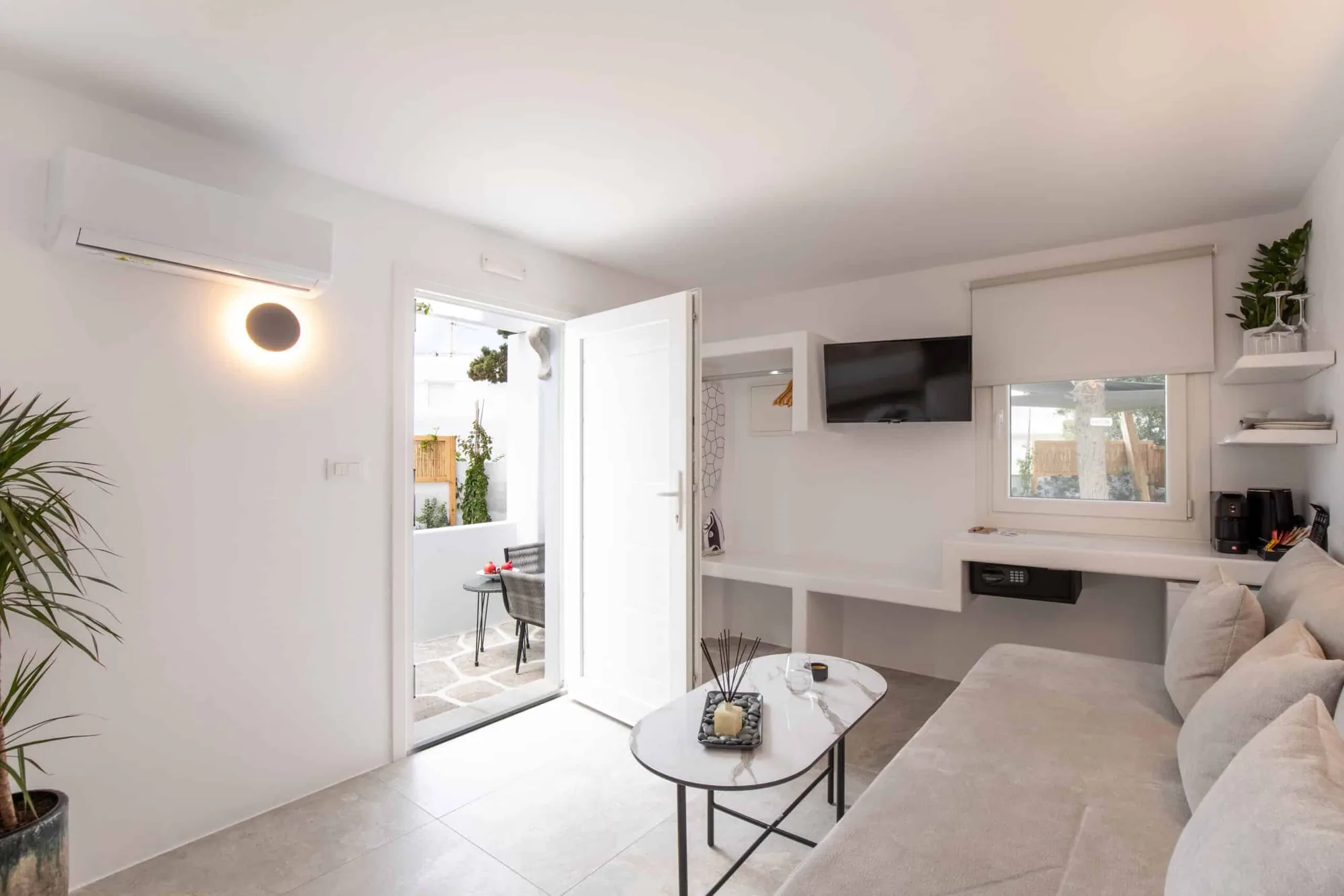 Standard Studio · Studio with sofa bed and the door open to the sitting area